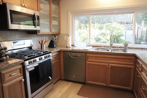 Fully upgraded kitchen with top of line appliances, utensils and cutlery