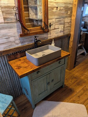 The vintage bath vanity, look on the left side for its story to tell!