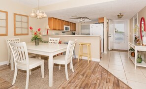 Dining table, chairs, kitchen counter, and counter stools