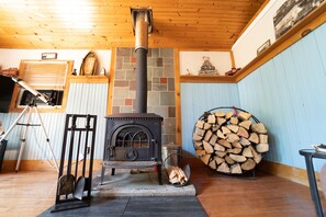 Wood burning stove in the large living room.we supply all the wood. 