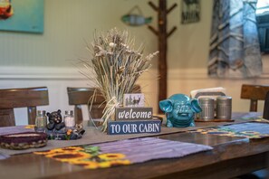 Welcome to our cozy cabin! Our dining room has lg farm table with big fireplace