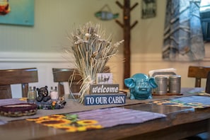 Welcome to our cozy cabin! Our dining room has lg farm table with big fireplace