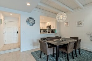 Counter top w/bar stools and dining table Copyright - propertiesbyams.com