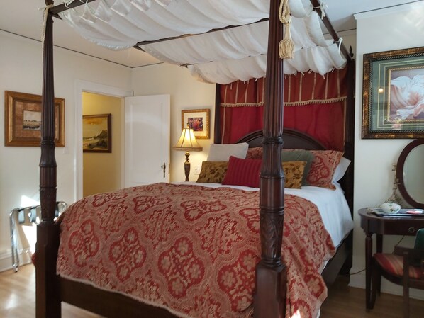 Mahoganey four poster canopy bed with luxurious bedding. Fit for a princess.
