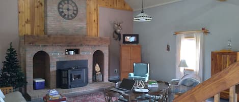 Great Room with cathedral ceiling and corn stove.  