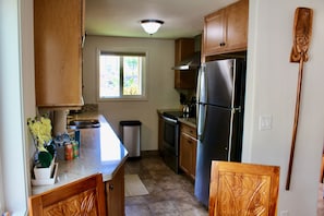Full size kitchen with several appliances provided.  
