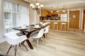 Open concept Living space. View from Living room into the Dining room & Kitchen