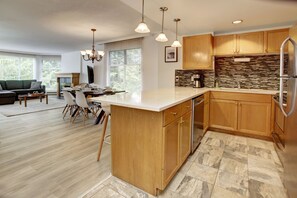 View from the open concept Kitchen into the Dining room and Living room