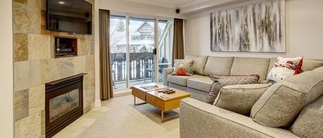 Open concept living room with brand new custom queen sofa bed, SMART Tv