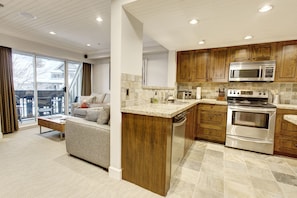 View from dining area looking into kitchen and living room