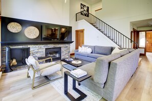 Open concept living space with Q sectional sleeper sofa with 65" 4K TV