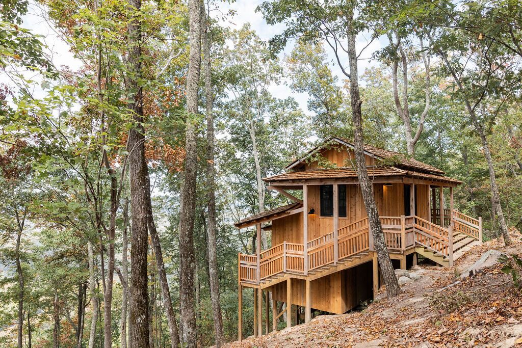 Japanese timberframe tiny house perched on side of Lookout