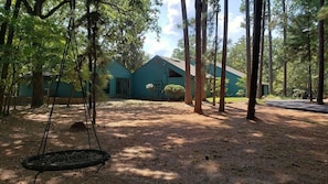 Front yard features a fun tree swing for the whole family to enjoy.