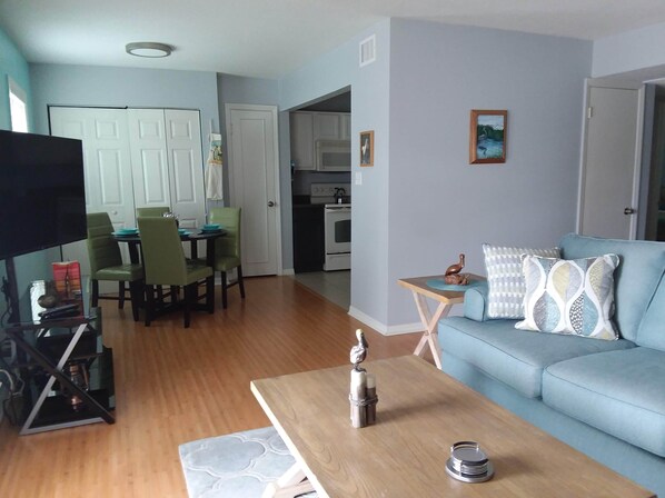 Living room, dining area, TV, Kitchen around the corner