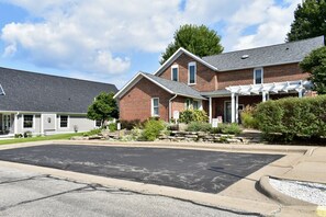 Private parking for Village House guests. Handicap accessible sidewalk. 