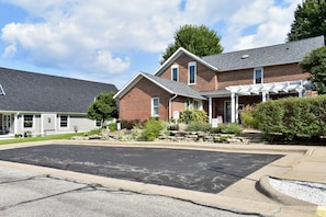 Private parking for Village House guests. Handicap accessible sidewalk.