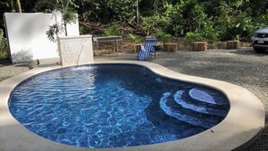 Pool at day with Waterfall. 