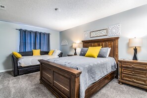 Larger bedroom has a queen bed and a twin sofa bed with a pull out twin mattress