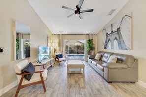 Comfortable leather sofa | Elegant decor | Beautiful tile floors throughout