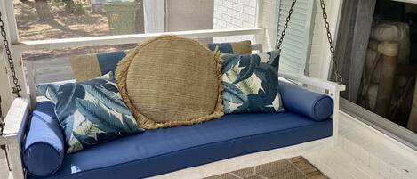 Cozy screened in front porch with swing 