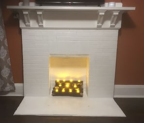 Fire place with remote controlled tea light candles