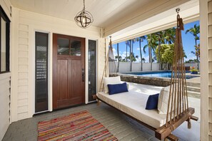 Entry to the home and pool side lanai lounger, my fave for a shaded nap.