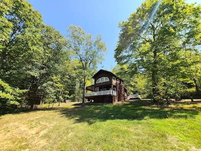 Charming cabin nestled deep in the woods, great for a getaway or event!