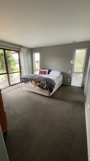 Master bedroom with outdoor access to deck