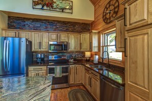 Large kitchen with high end appliances and granite