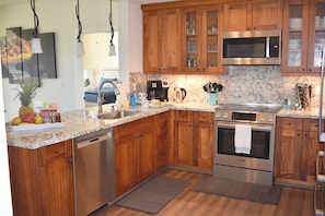 Gourmet kitchen has all major appliances and is equipped to make food prep easy