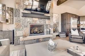 Stone gas fireplace and large flat panel TV