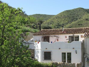 Front of the property with mountain backdrop