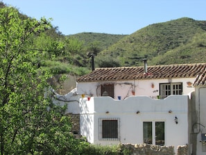 Front of the property with mountain backdrop