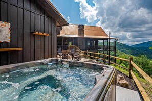 Hot tub has wide mountain views.