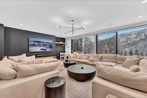 Family Room Featuring Cloud Couches and Views of the Slopes