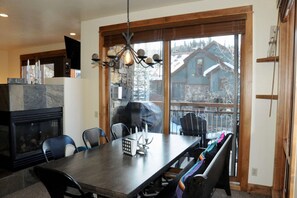 Cozy dining space leading out to your private balcony and gas grill