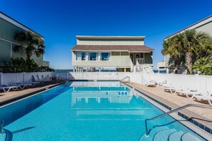 The community pool is just steps from the condo