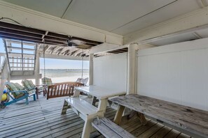 The covered porch below offers a great spot for the whole family to gather