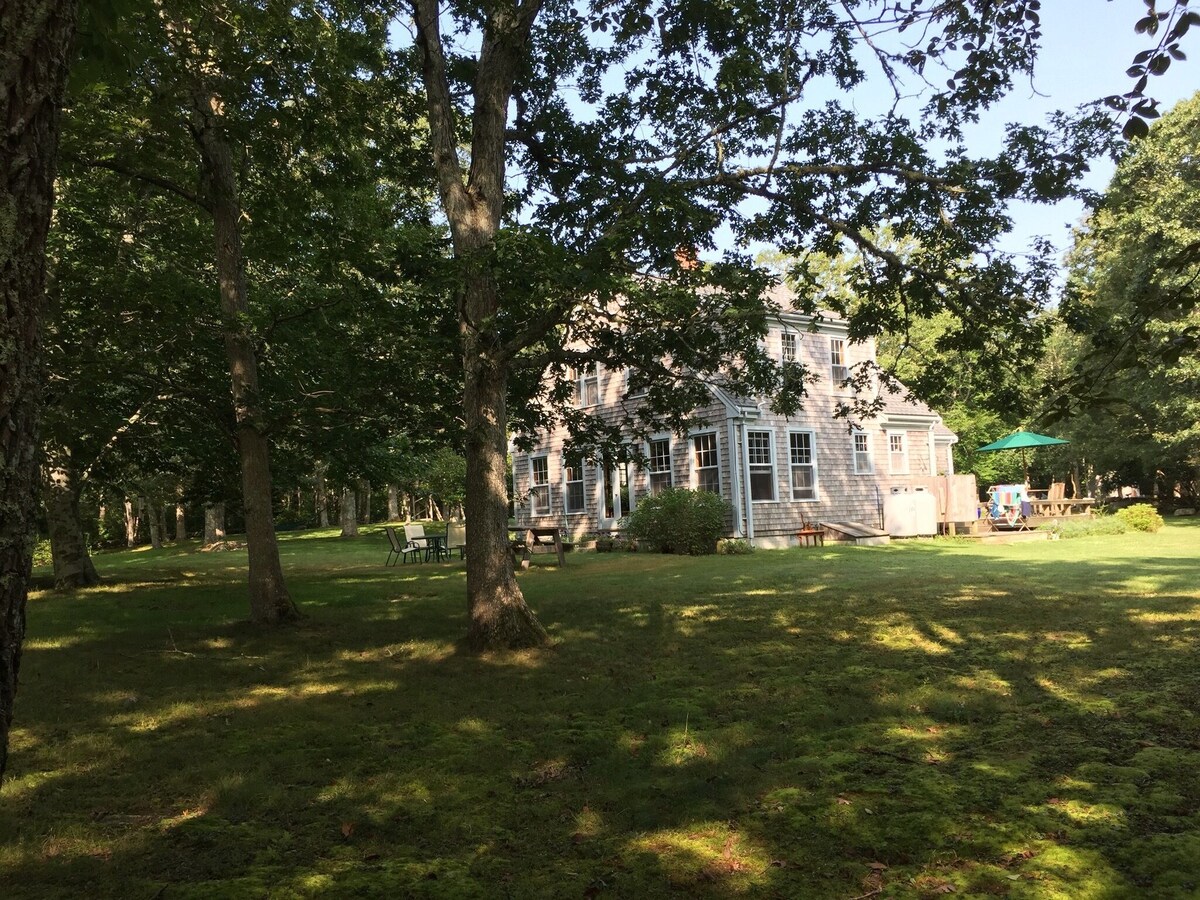 Secluded house in the woods with deck, streamside firepit, Vincent Beach nearby