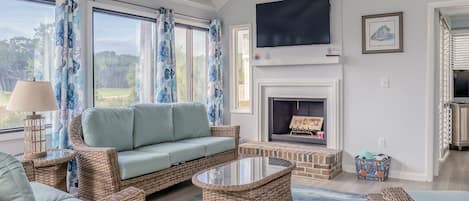 Living room area with vaulted ceiling