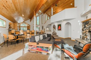 Living Room with Gas Firelace, Comfortable Seating Area, and Card Table