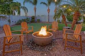 Imagine yourself toasting the good life in front of the warm propane fire pit.