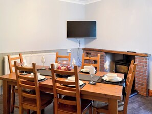 Cosy dining room with wood burner | Butterhole Farmhouse, Mabie, near Dumfries