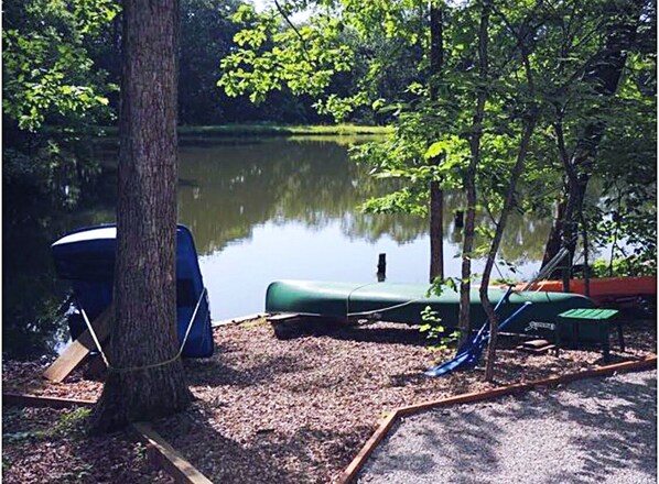 A paddle boat, canoe, paddle board, two kayaks, and 6’x15’ lily pad at the ready