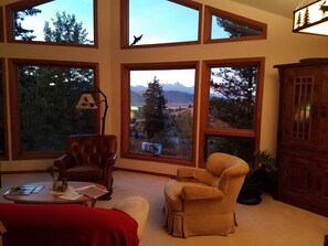 Living room at dusk with views of the Tetons.