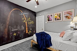 Chalkboard wall in Bedroom #2 with extra  Trundle Bed underneath, Smart Roku TV.