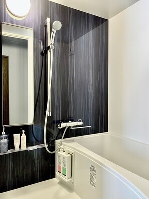 Private bathroom with bathtub