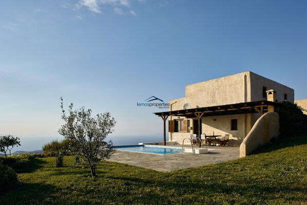 The house, garden and pool.