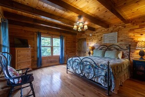 Master bedroom with king size bed and tv