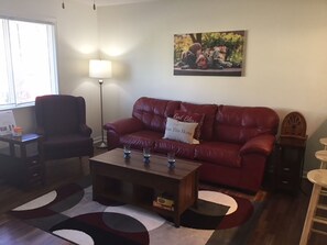 Nicely Furnished Living Room with new Simmons queen sleeper sofa.